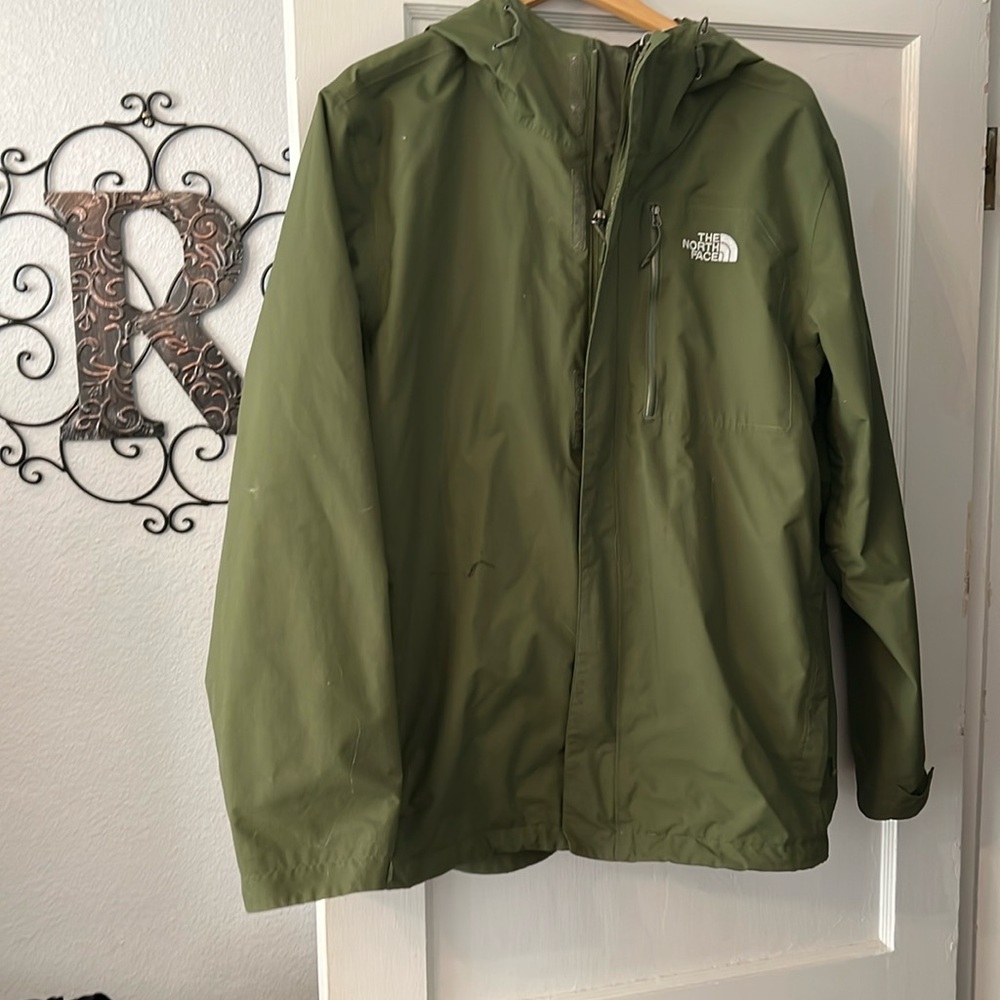 The North Face jacket is lined and zips as well as well as has a velcro.